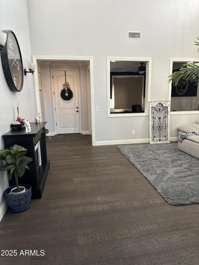 entryway with baseboards and visible vents