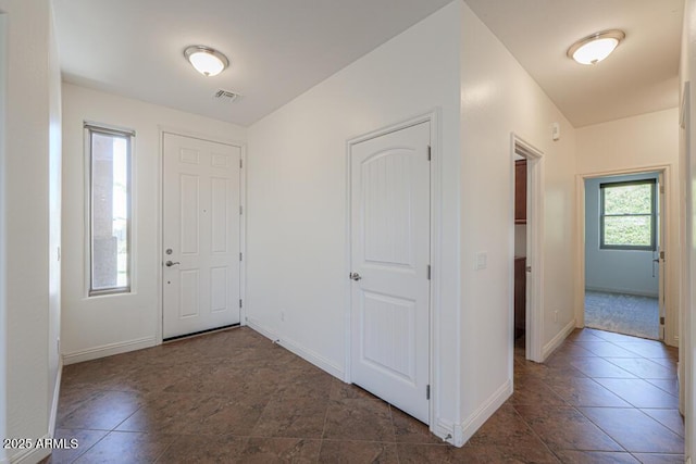 entrance foyer featuring visible vents and baseboards