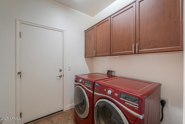 washroom with washer and dryer and cabinet space