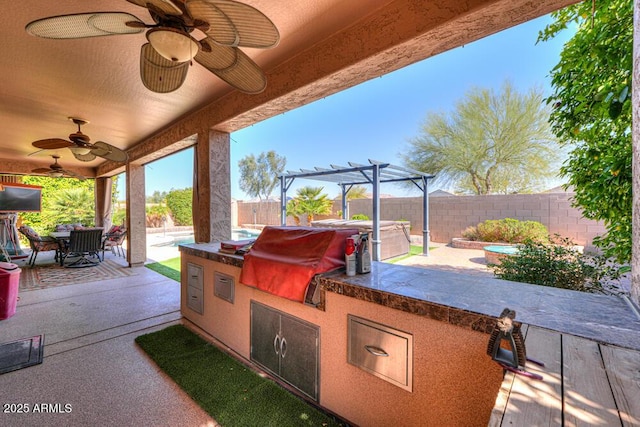 view of patio with outdoor dining space, a grill, exterior kitchen, and a fenced backyard