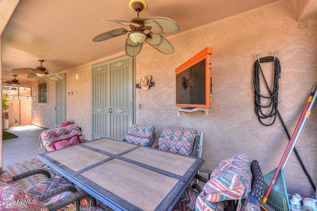 view of patio / terrace with outdoor dining space and a ceiling fan