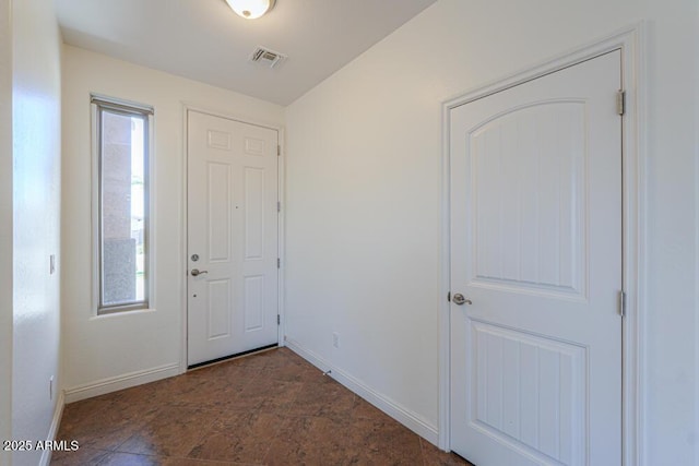 entryway featuring plenty of natural light, baseboards, and visible vents