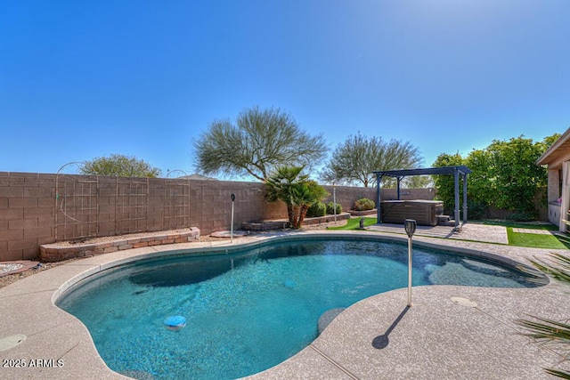 view of swimming pool with a fenced in pool, a patio, a hot tub, and a fenced backyard