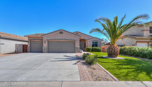 mediterranean / spanish home with a front lawn, an attached garage, driveway, and stucco siding