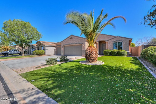 view of front of house featuring a front yard, fence, stucco siding, concrete driveway, and a garage