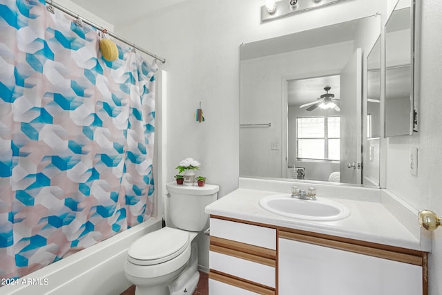 full bathroom with ceiling fan, shower / bath combo, vanity, and toilet