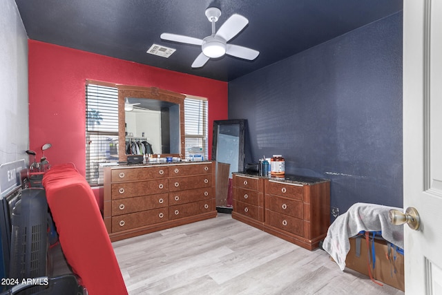 bedroom featuring light wood-type flooring and ceiling fan