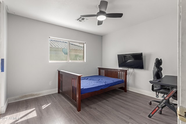 bedroom featuring ceiling fan and wood-type flooring