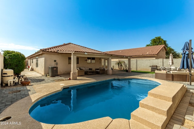 view of pool featuring an outdoor hangout area, a patio, and central AC