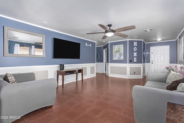 living room featuring crown molding and ceiling fan