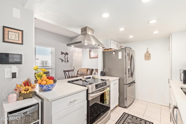 kitchen featuring white cabinetry, island exhaust hood, stainless steel appliances, and light tile patterned flooring