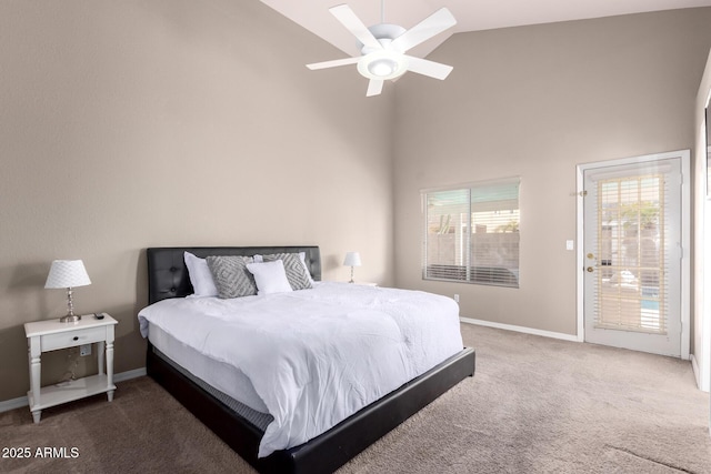 carpeted bedroom with access to exterior, a ceiling fan, baseboards, and high vaulted ceiling