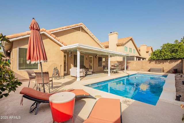 view of swimming pool with a patio area, a fenced backyard, and a fenced in pool