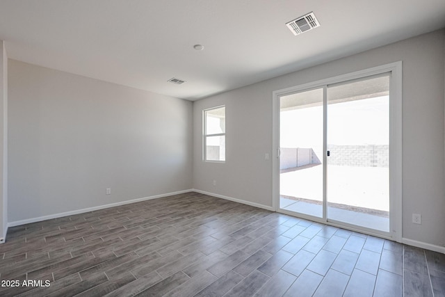 19320 N Diego Way, Maricopa, AZ 85138 - spare room featuring wood finished floors and baseboards