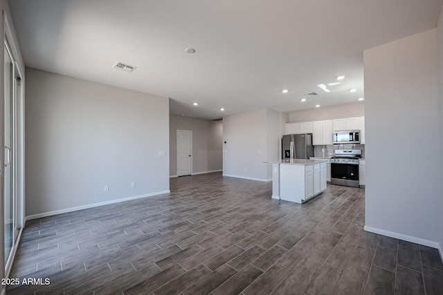 19320 N Diego Way, Maricopa, AZ 85138 - unfurnished living room with recessed lighting, dark wood-type flooring, and baseboards