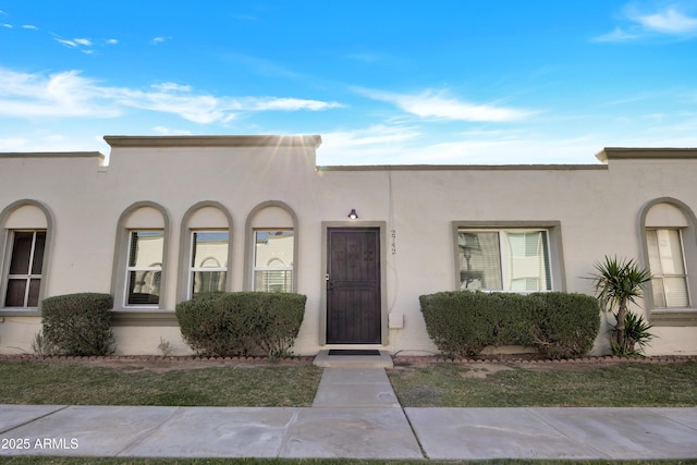 mediterranean / spanish-style home with stucco siding