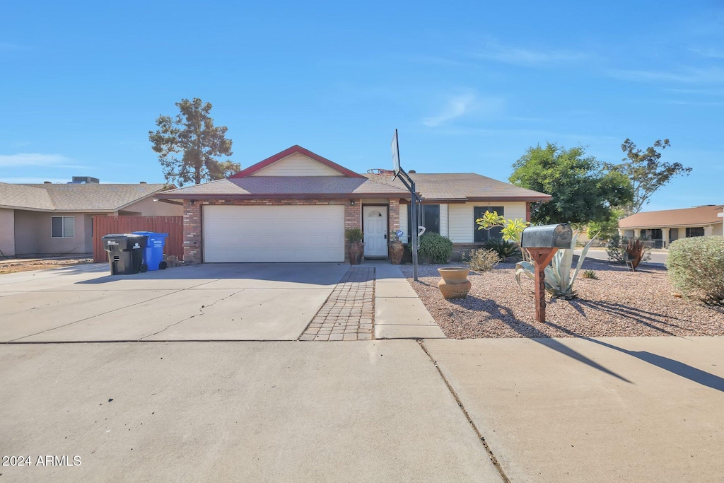 ranch-style home featuring a garage