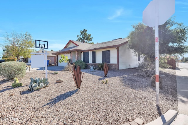 ranch-style house featuring a garage