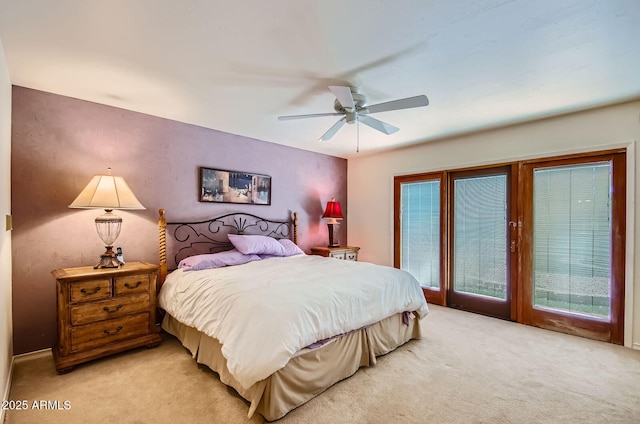 8355 E Via De Los Libros, Scottsdale, AZ 85258 - bedroom featuring light carpet, access to exterior, multiple windows, and ceiling fan