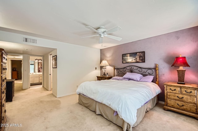 8355 E Via De Los Libros, Scottsdale, AZ 85258 - bedroom featuring light carpet, connected bathroom, and ceiling fan