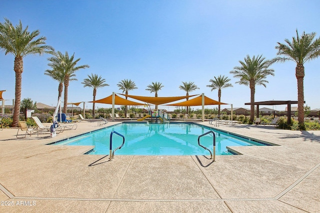 view of swimming pool featuring a patio