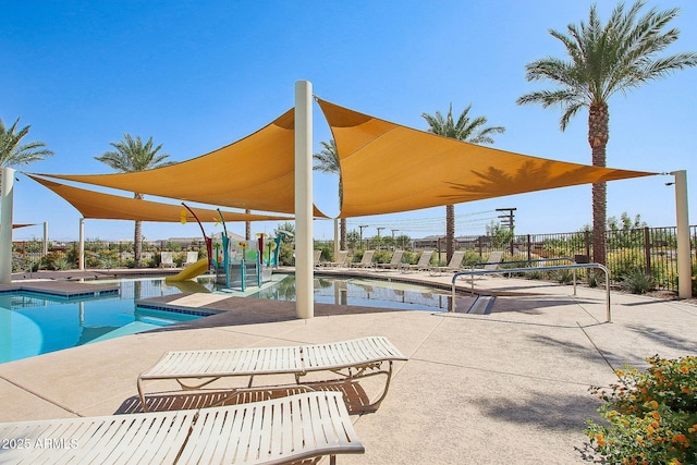 view of pool with a hot tub