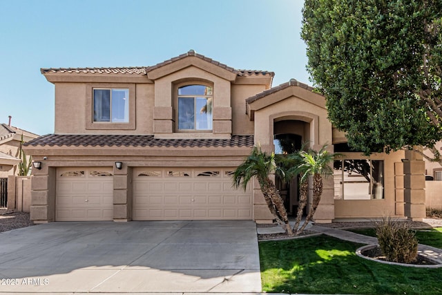 mediterranean / spanish-style house with a garage