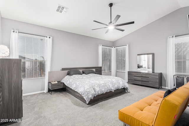 carpeted bedroom featuring vaulted ceiling and ceiling fan