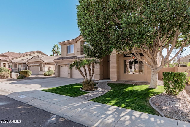 view of front of property featuring a garage and a front yard