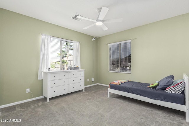 bedroom featuring ceiling fan and light carpet