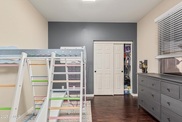 bedroom featuring dark hardwood / wood-style flooring