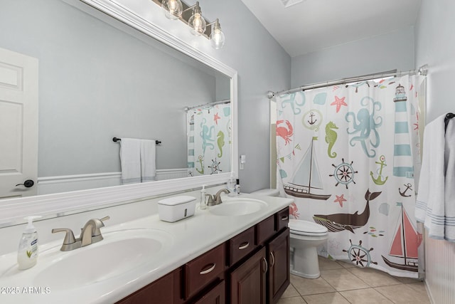 bathroom featuring vanity, toilet, curtained shower, and tile patterned flooring