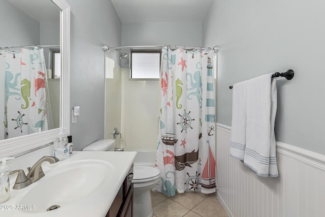 full bathroom featuring shower / bath combination with curtain, vanity, tile patterned floors, and toilet