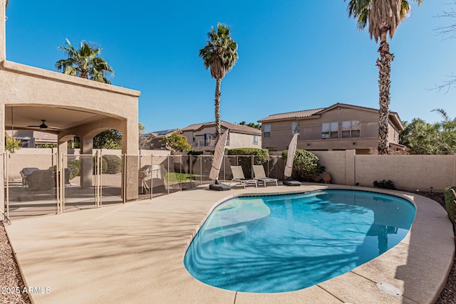 view of swimming pool with a patio area and ceiling fan