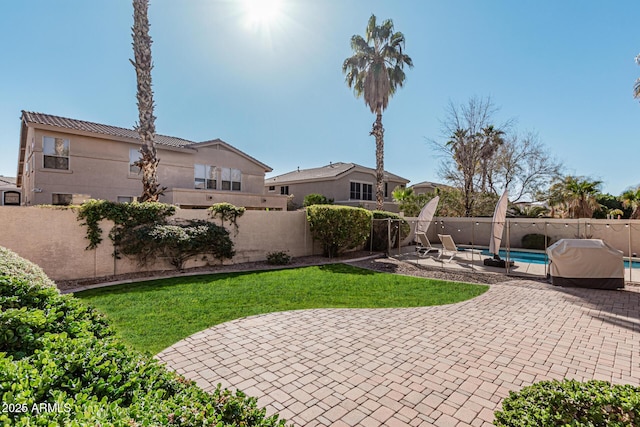 view of patio with a fenced in pool