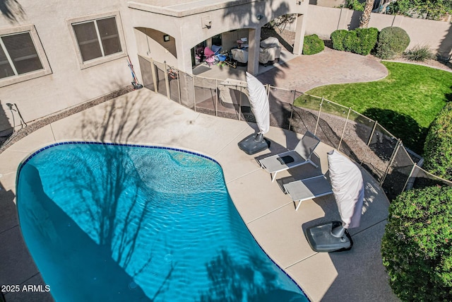 view of swimming pool with a patio