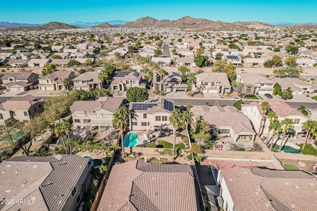 birds eye view of property with a mountain view