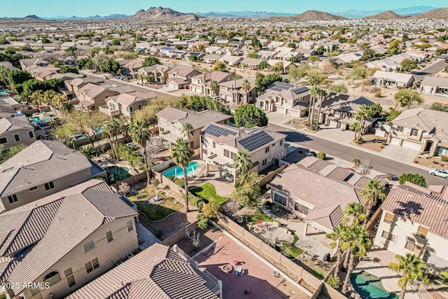 birds eye view of property featuring a mountain view