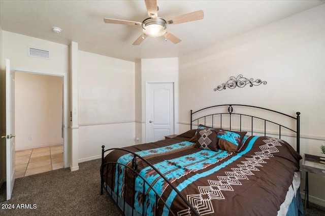 carpeted bedroom featuring ceiling fan