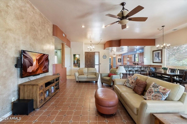 living room featuring tile flooring and ceiling fan with notable chandelier