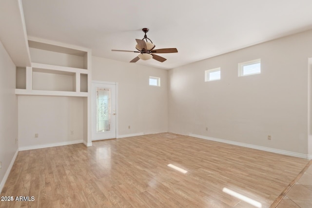30124 N 174th St, Rio Verde, AZ 85263 - unfurnished living room featuring a ceiling fan, light wood-style floors, and baseboards