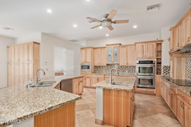 30124 N 174th St, Rio Verde, AZ 85263 - kitchen with a sink, an island with sink, light brown cabinetry, and recessed lighting