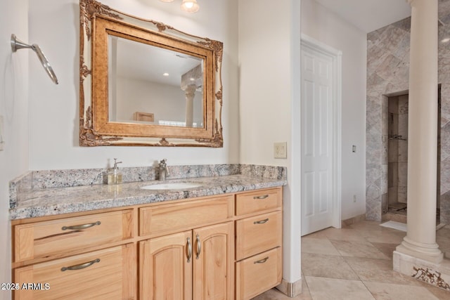 30124 N 174th St, Rio Verde, AZ 85263 - full bathroom featuring a stall shower, vanity, decorative columns, and tile patterned floors