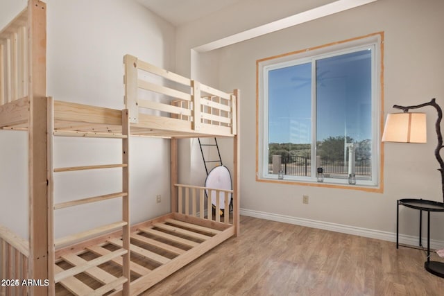 30124 N 174th St, Rio Verde, AZ 85263 - unfurnished bedroom featuring wood finished floors and baseboards
