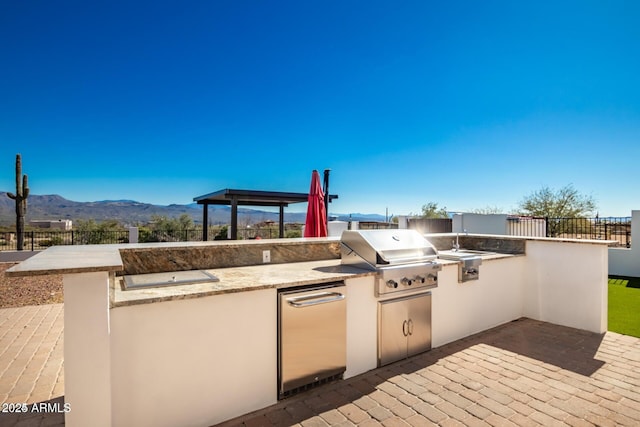 30124 N 174th St, Rio Verde, AZ 85263 - view of patio / terrace featuring a grill, fence, an outdoor kitchen, a mountain view, and a gazebo