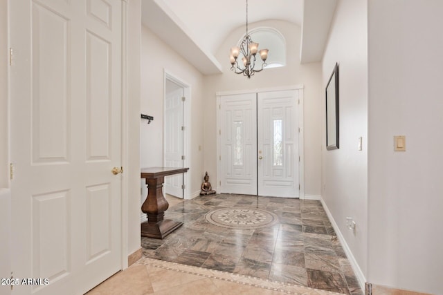 30124 N 174th St, Rio Verde, AZ 85263 - entrance foyer featuring marble tiled floors, baseboards, a chandelier, inlaid floor details, and vaulted ceiling