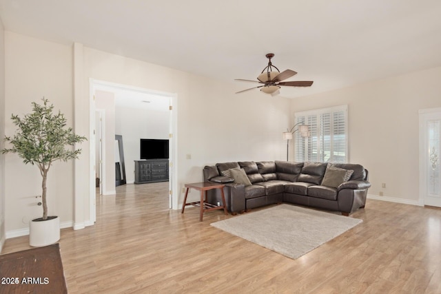 30124 N 174th St, Rio Verde, AZ 85263 - living room featuring ceiling fan, light wood-type flooring, and baseboards