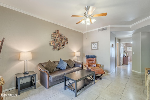 living area with visible vents, ornamental molding, baseboards, a ceiling fan, and light tile patterned floors