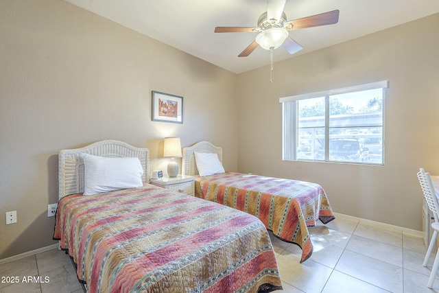 bedroom with light tile patterned floors, baseboards, and a ceiling fan