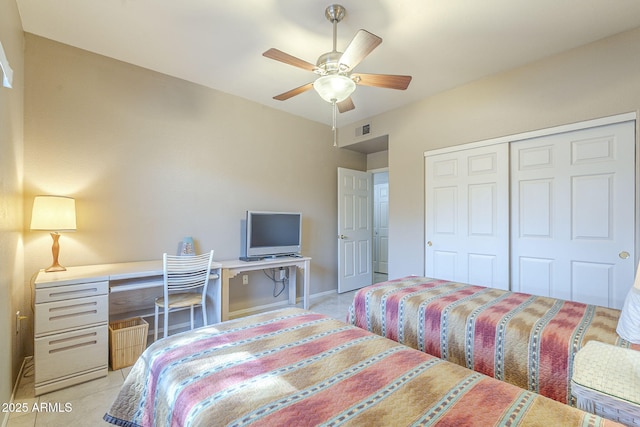 bedroom with baseboards, ceiling fan, a closet, and visible vents